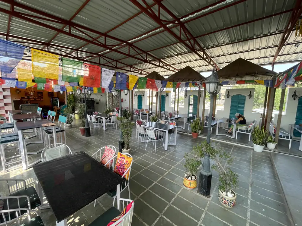 Rooftop dining area with bunting and open seating